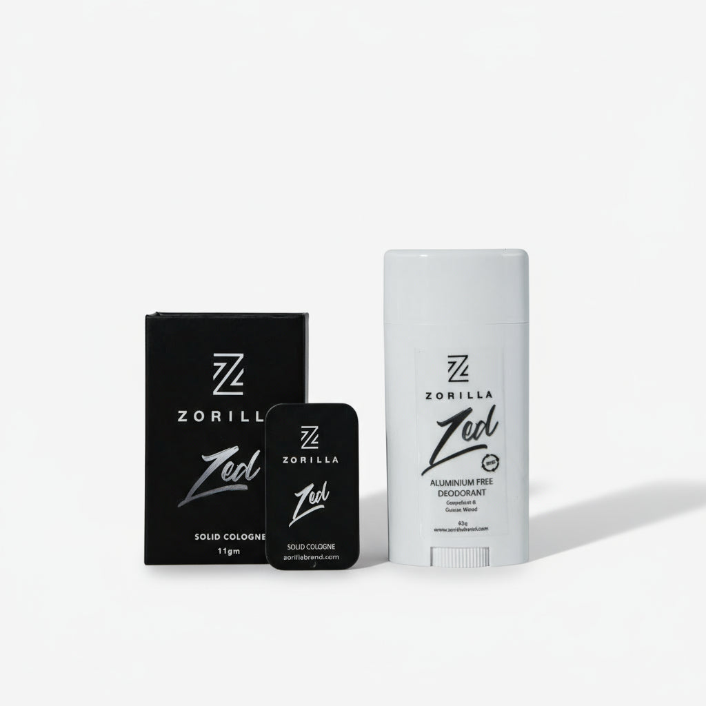 A product image featuring a white stick deodorant and a black bottle of cologne, both with 'Zorilla' branding and 'Zed' cologne reference. Presented on a marble background.